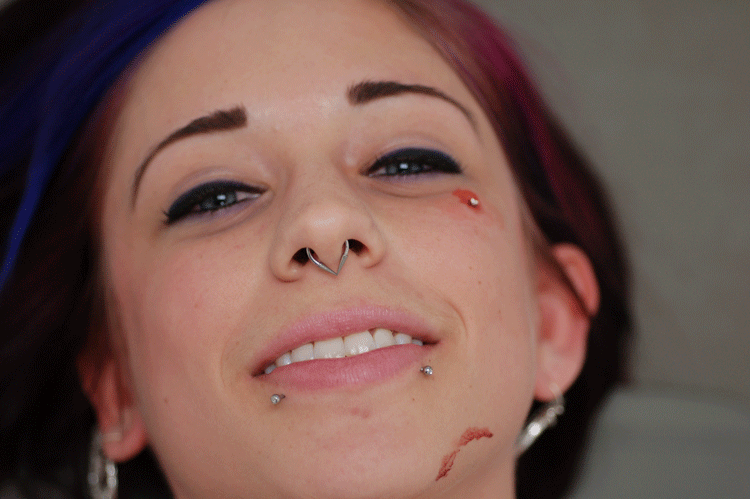 Shh she doesn't know she's got a little blood on her face...