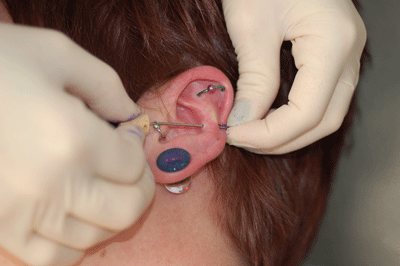 after freehanding this piercing it's all about the cork for safety